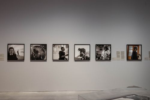 Exhibition view "Akinbode Akinbiyi": View of a portrait series consisting of square black and white photographs portraying various artists.