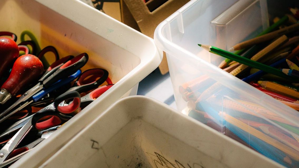 Photo: Boxes of crayons, pencils, scissors and colourful tapes.