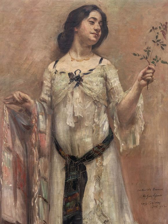 Painting of a woman in a white dress holding a small twig in her right hand. She has dark, tied-back hair, wears a delicate necklace, and gazes to the side with a slight smile. The dress is adorned with colorful fabric details and a dark belt. The background is rendered in warm, earthy tones.