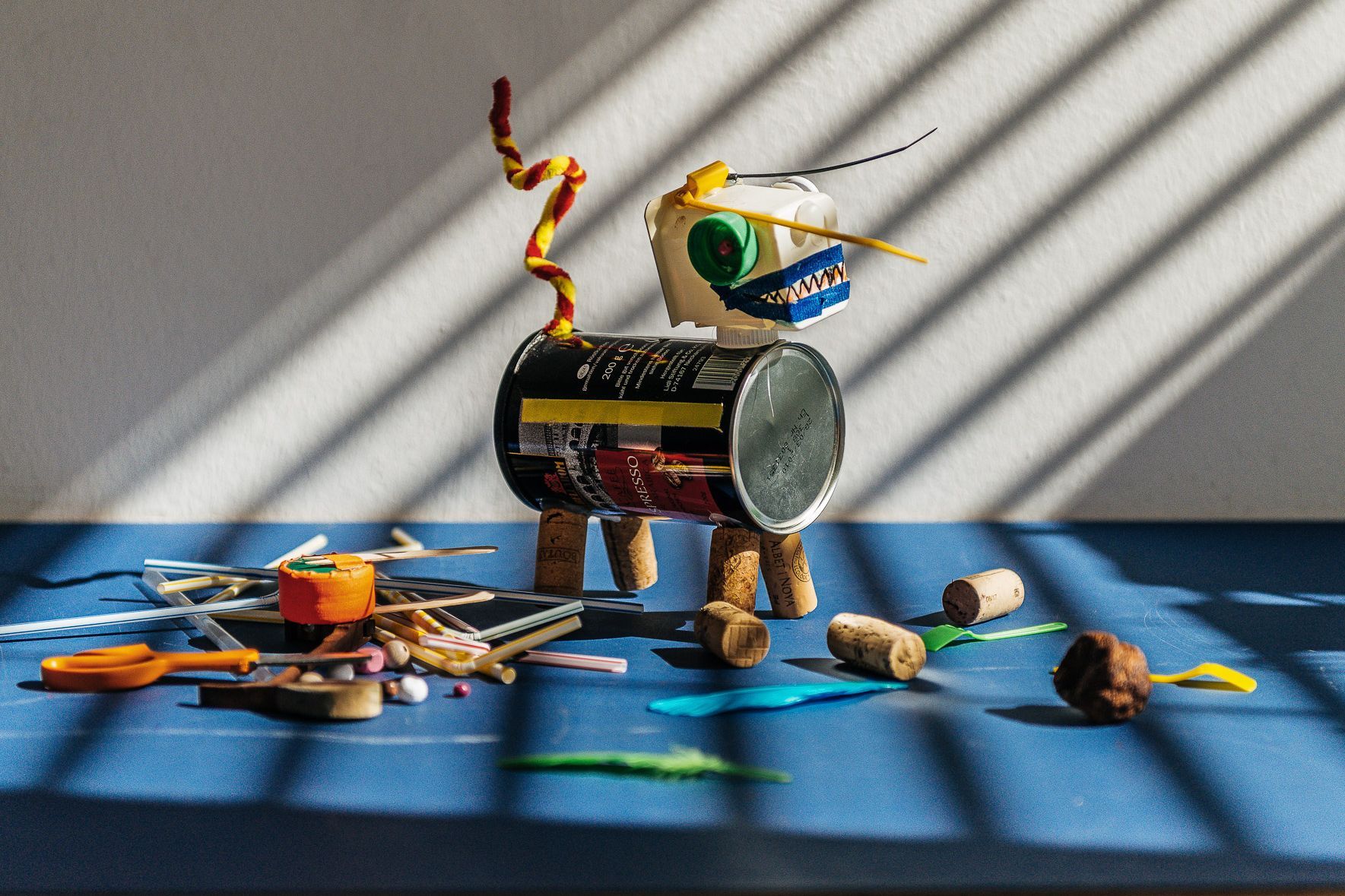 Photo: A crafted object on a table with craft materials.