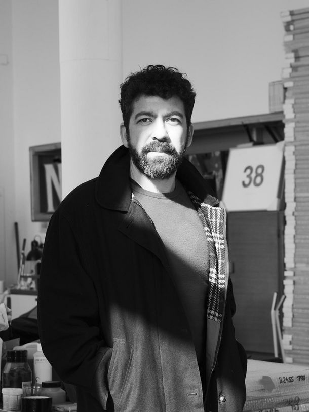 Black and white photo portrait of the artist Nasan Tur