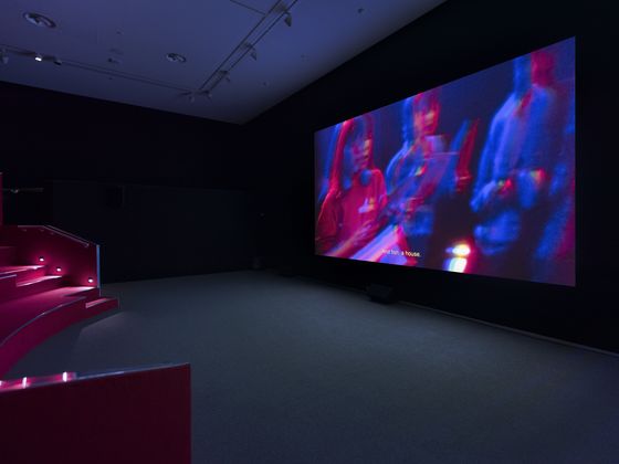 View of the video room with projection of the work onto a screen