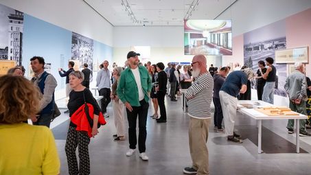 Photo: Snapshots of the opening, showing people either inside the exhibition rooms or in the outdoor area of the Berlinische Galerie.