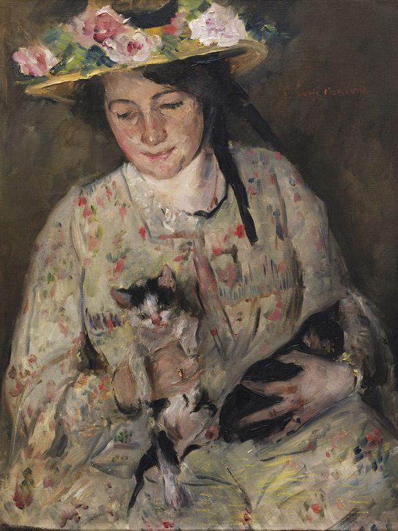 Painting of a dark-haired person read as female wearing a flower-adorned hat and holding two cats in her arms.